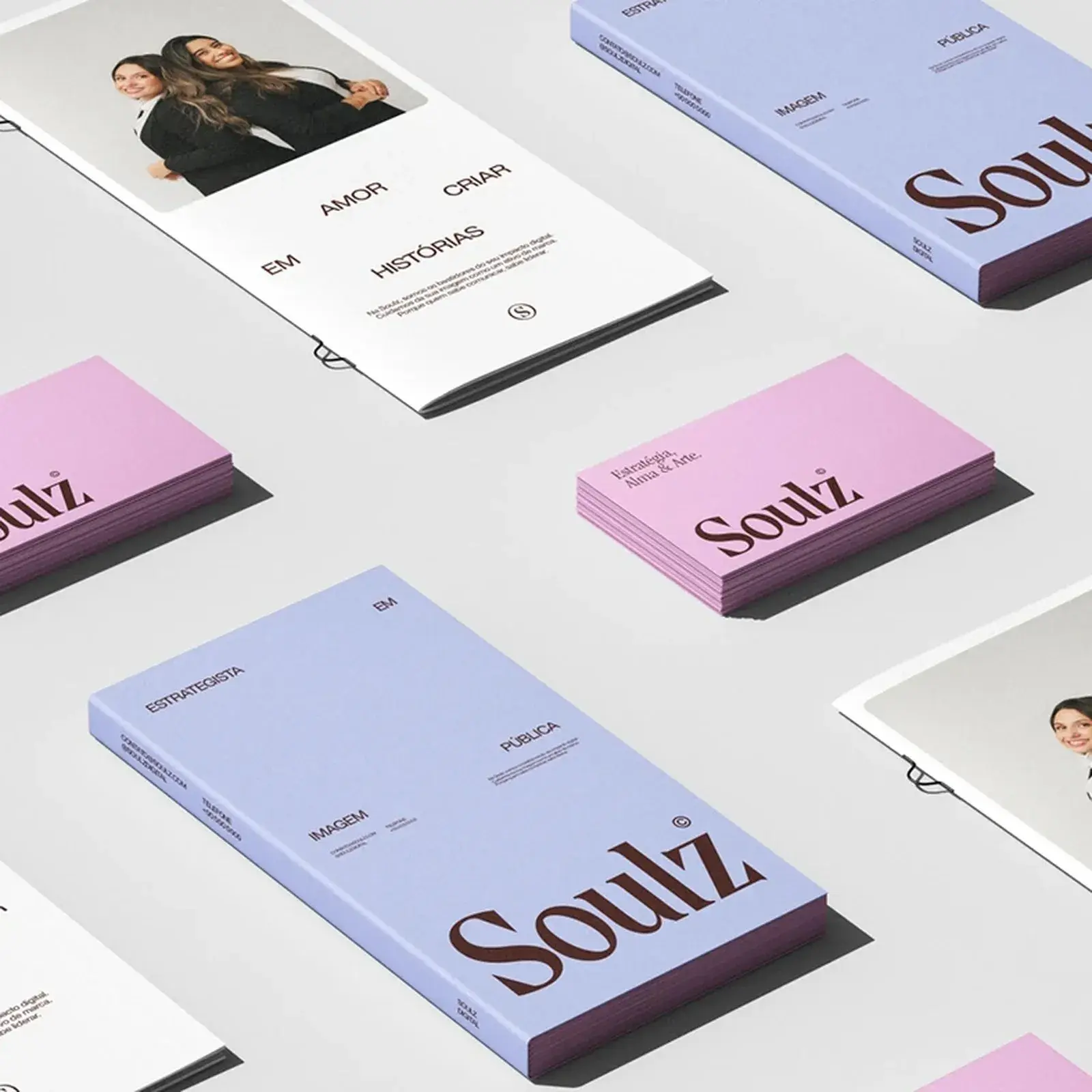 Soulz brand identity flat-lay of publications and business cards in lavender and pink by Uncave Studio